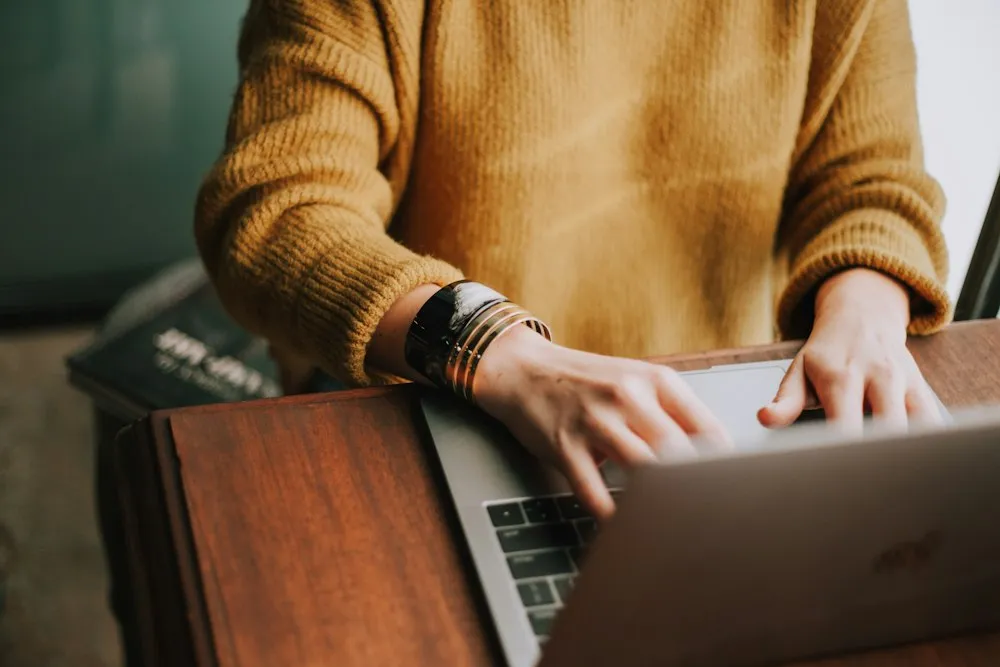 Person researching questions on a laptop